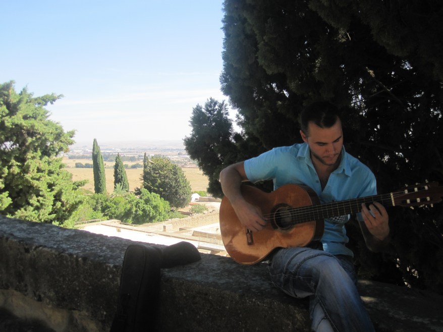 Paco playing the guitar at Medina Azahara